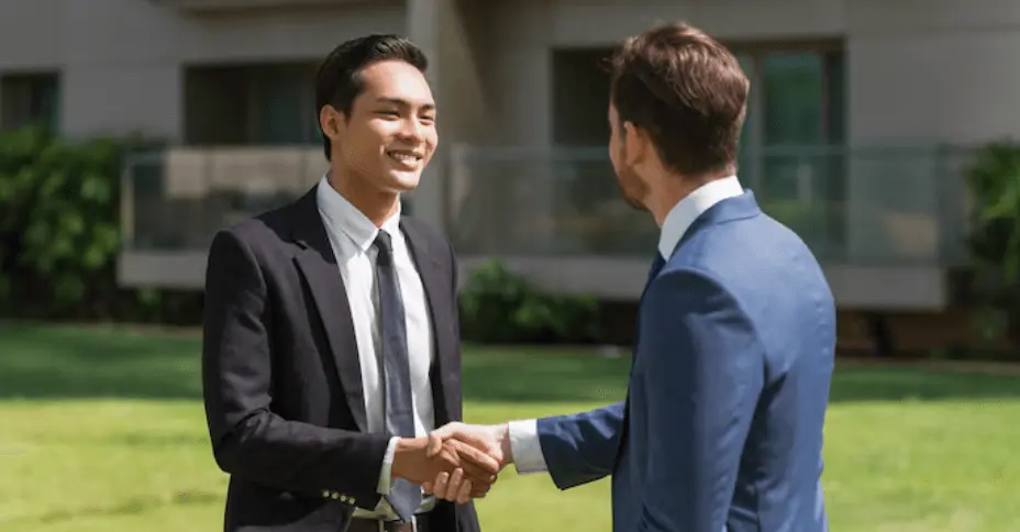 two smiling partners doing an introduction in english
