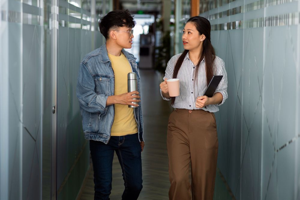 featured image of 2 people using transitive phrasal verbs