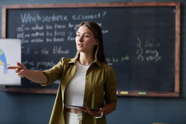 image of a person teaching resent perfect tense
