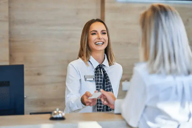featured image of a receptioninst using future perfect tense in a conversation