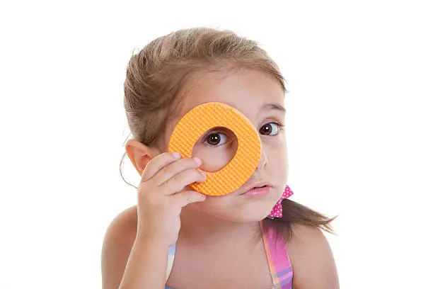 image of a kid holding letter o